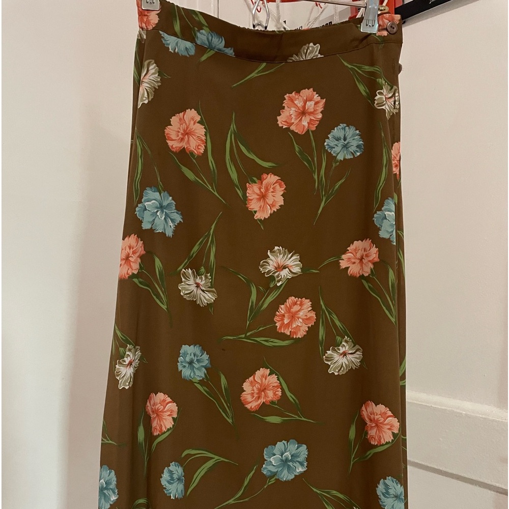 Brien with salmon color flower skirt.